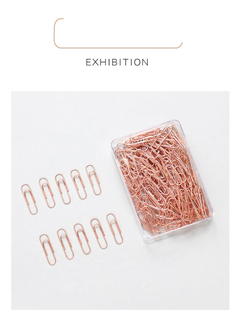 Rose gold heart-shaped metal paper clips, 28mm size, shown in a pack of 100.
