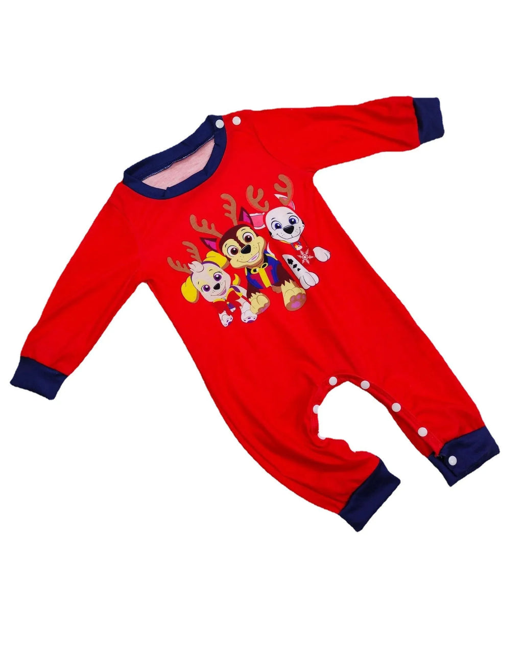 Family wearing matching red deer plaid Christmas pyjamas with adults, children, baby, and dog