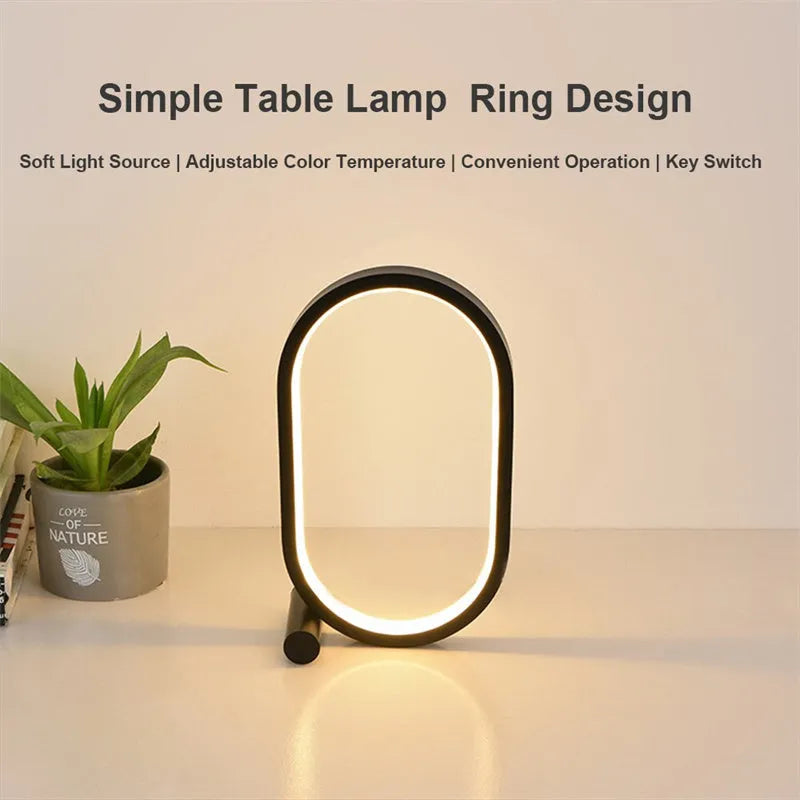 USB plug-in oval acrylic touch lamp with dimmable LED, metal body, on a bedside table