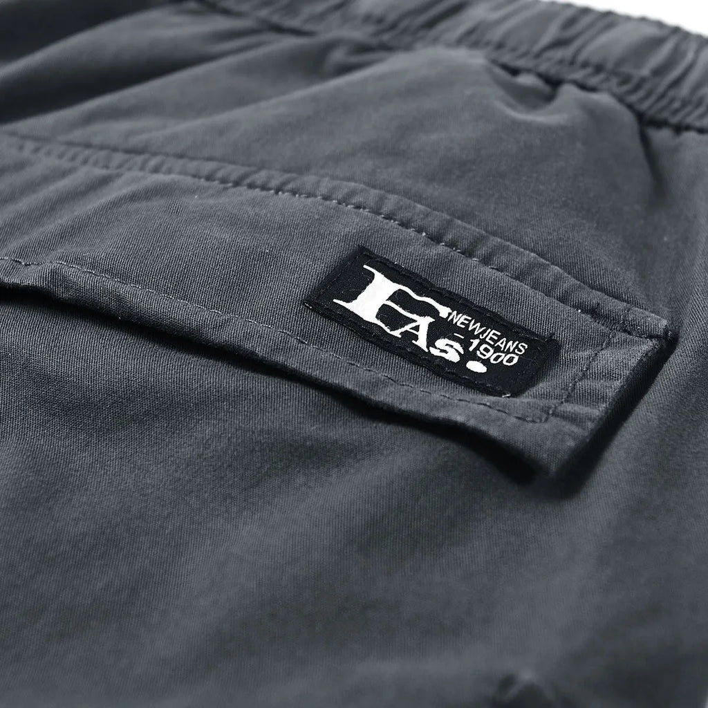 Men's cotton cargo shorts in solid black, mid-waist fit, size M to 3XL