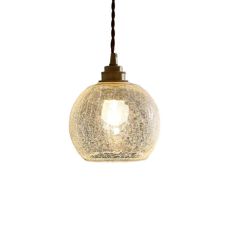 Retro brass ceiling chandelier with a clear glass ball shade, showing copper construction.
