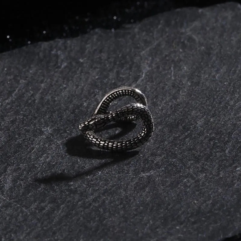 Retro snake-shaped alloy ear clip with electroplated finish on a neutral background