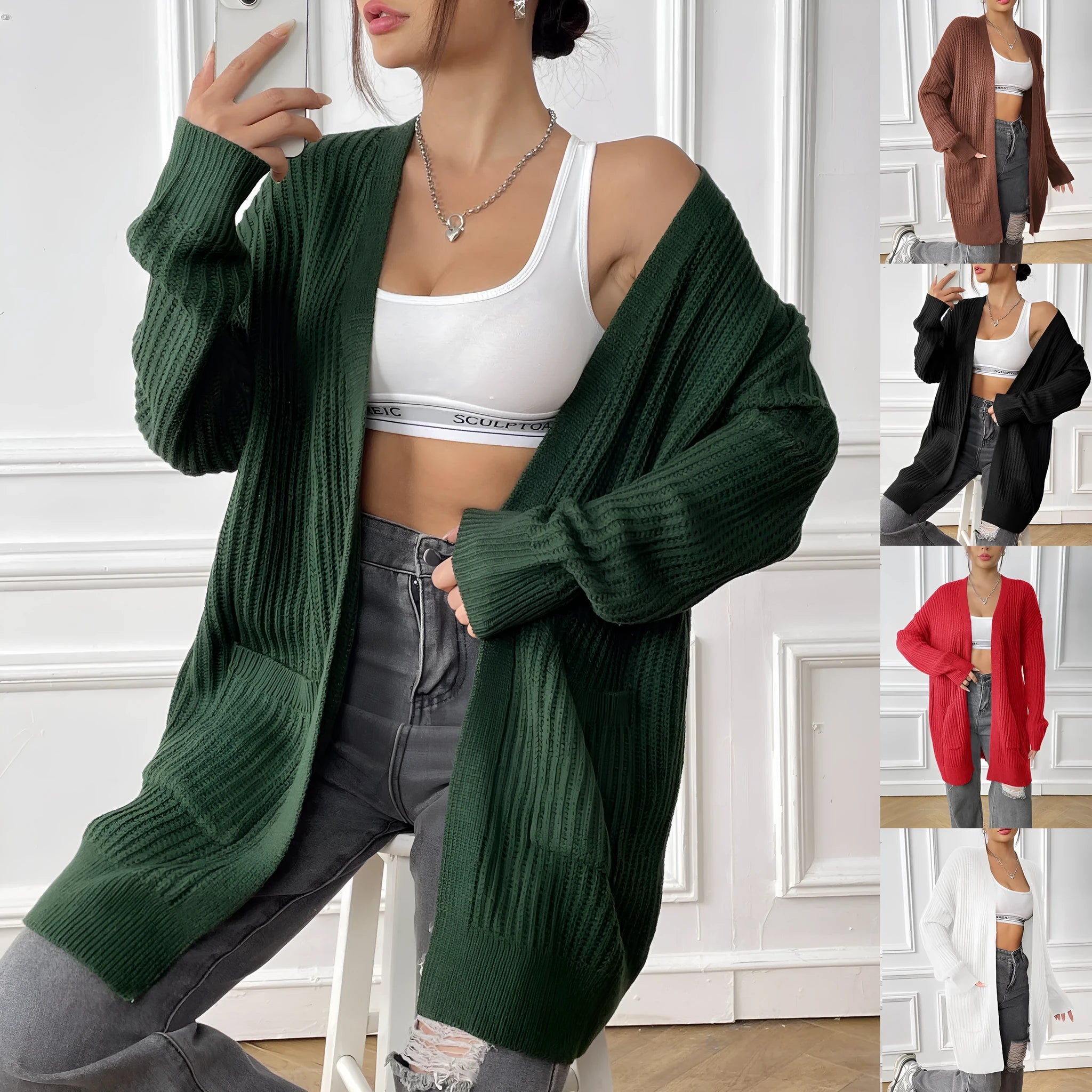 A woman's loose-fit mid-length cardigan in a solid colour, shown on a hanger.
