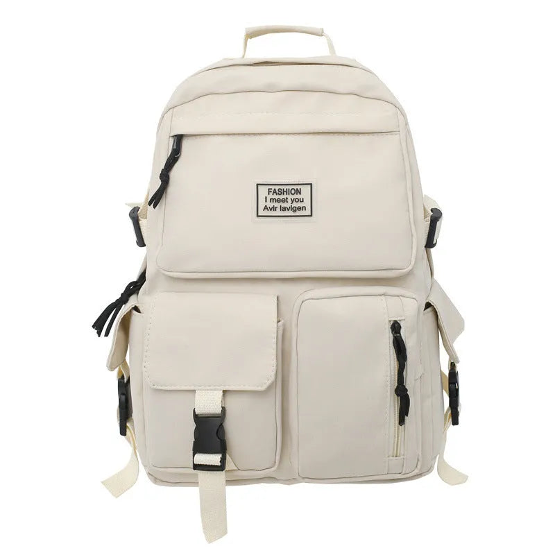 Black and white nylon student backpack with laptop compartment and 3D pockets.