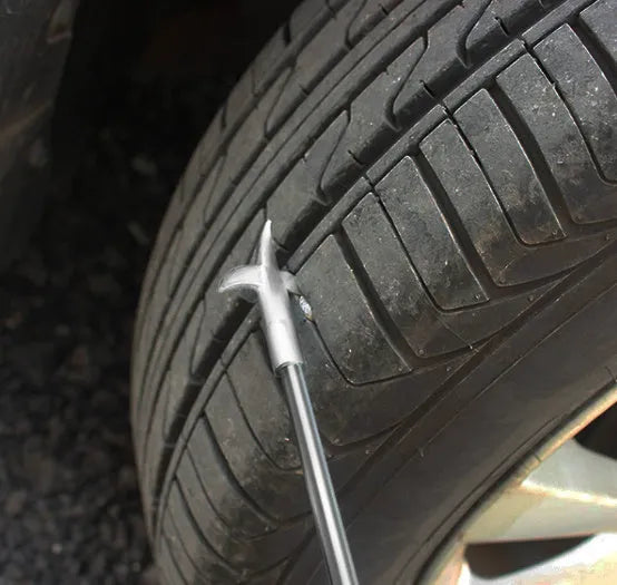 Portable alloy tyre cleaning tool set with built-in Phillips screwdriver and stone artifact, long style, on a white background.