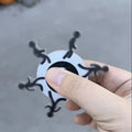 Acrylic stickman running fingertip gyro on finger showing spinning motion