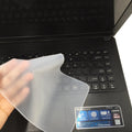 Transparent silicone keyboard dust film for laptop, showing close fit over keys