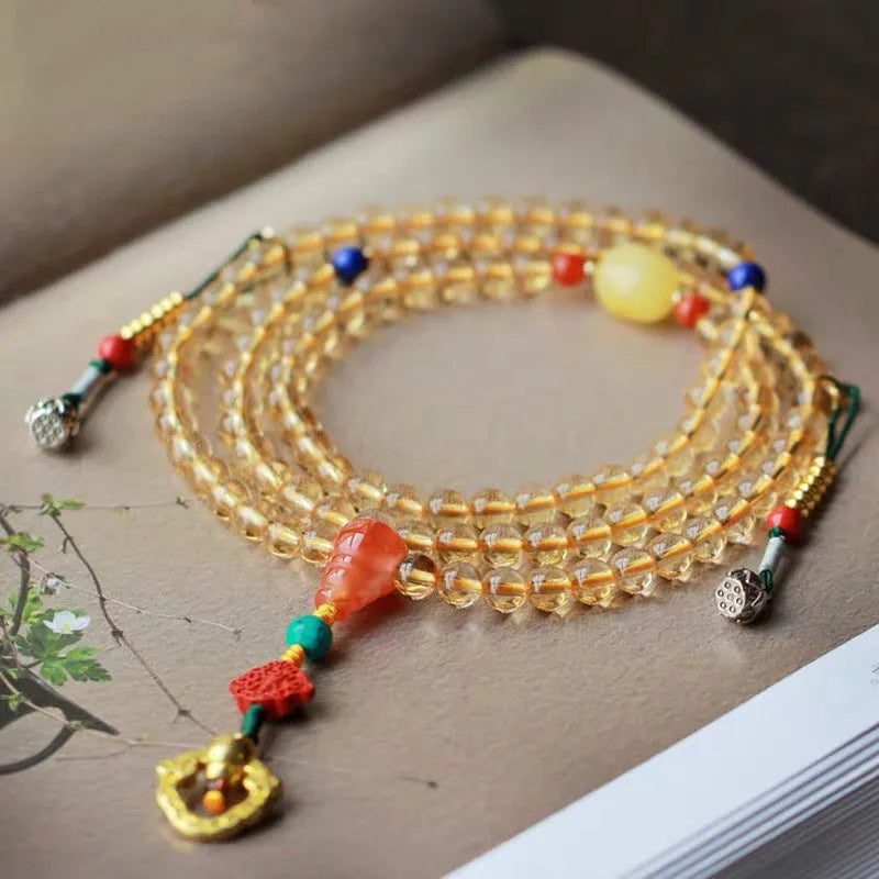 Yellow natural citrine beaded bracelet with 1mm beads on a filament strand.