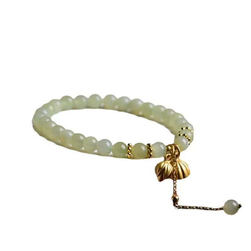 Natural Hetian Jade bracelet with Fu character detail on 6mm beads in a sunny water colour.