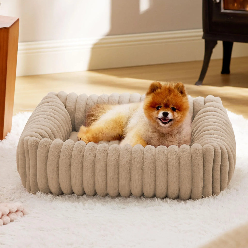 Soft winter dog bed cushion in beige colour showing raised sides and plush sleeping surface