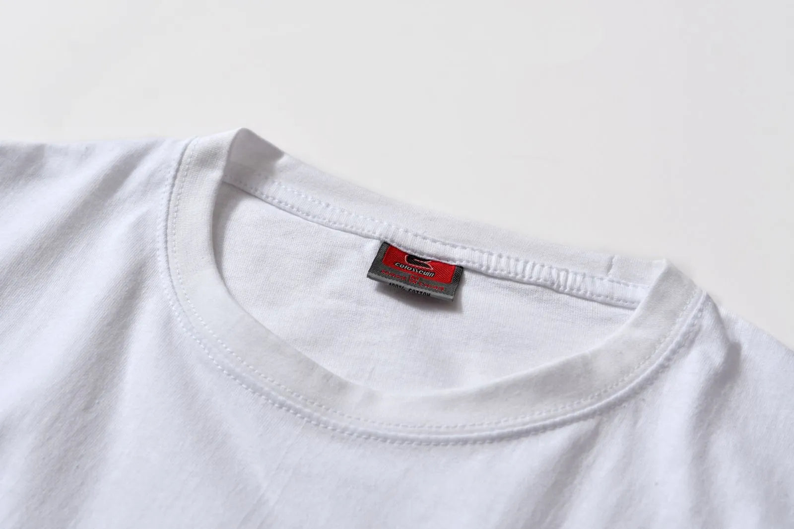White cotton denim overalls with round neck and short sleeves, loose fit pullover style