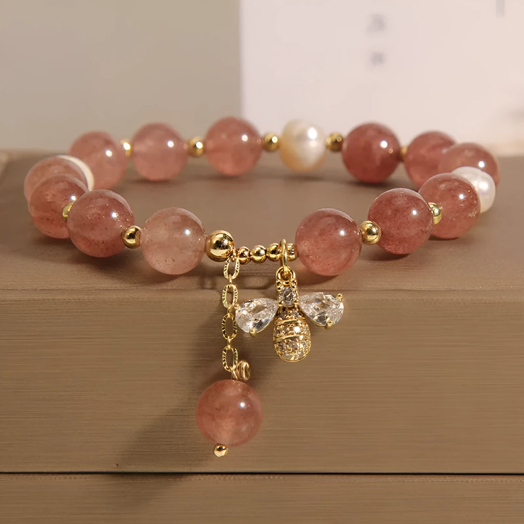Women's bracelet with strawberry quartz beads, freshwater pearls, and zircon accents on an alloy setting.