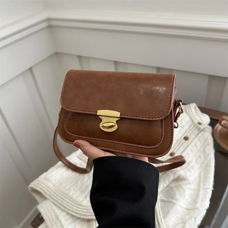 Soft PU leather small square handbag in horizontal rectangular shape showing black colour option