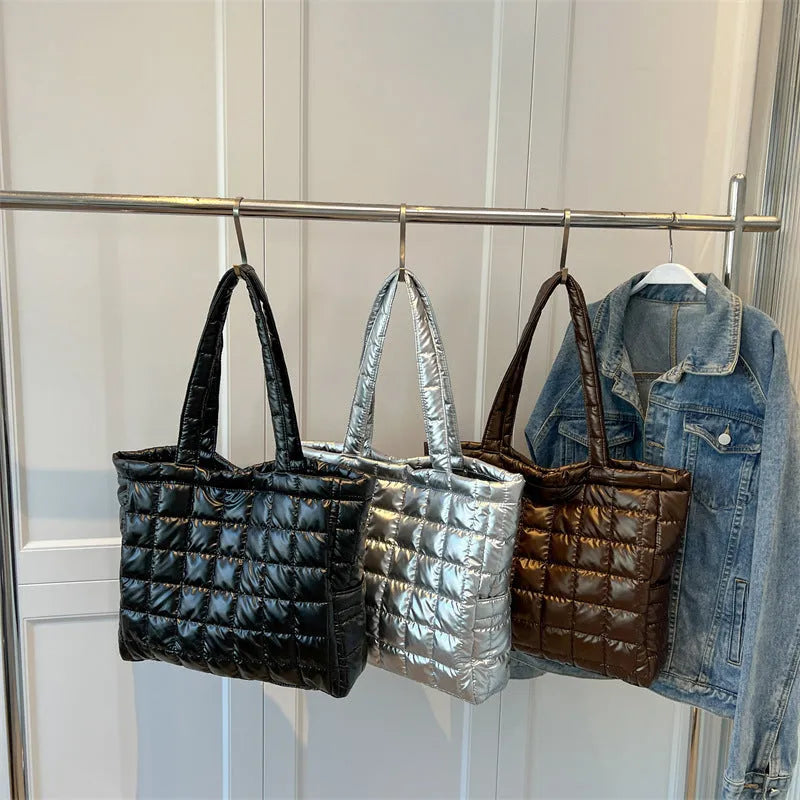 Large nylon plaid bucket shoulder bag in black with rhombus pattern, magnetic buckle, and soft handle.