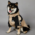 Khaki polyester dog shell jacket with zip closure shown on a dog