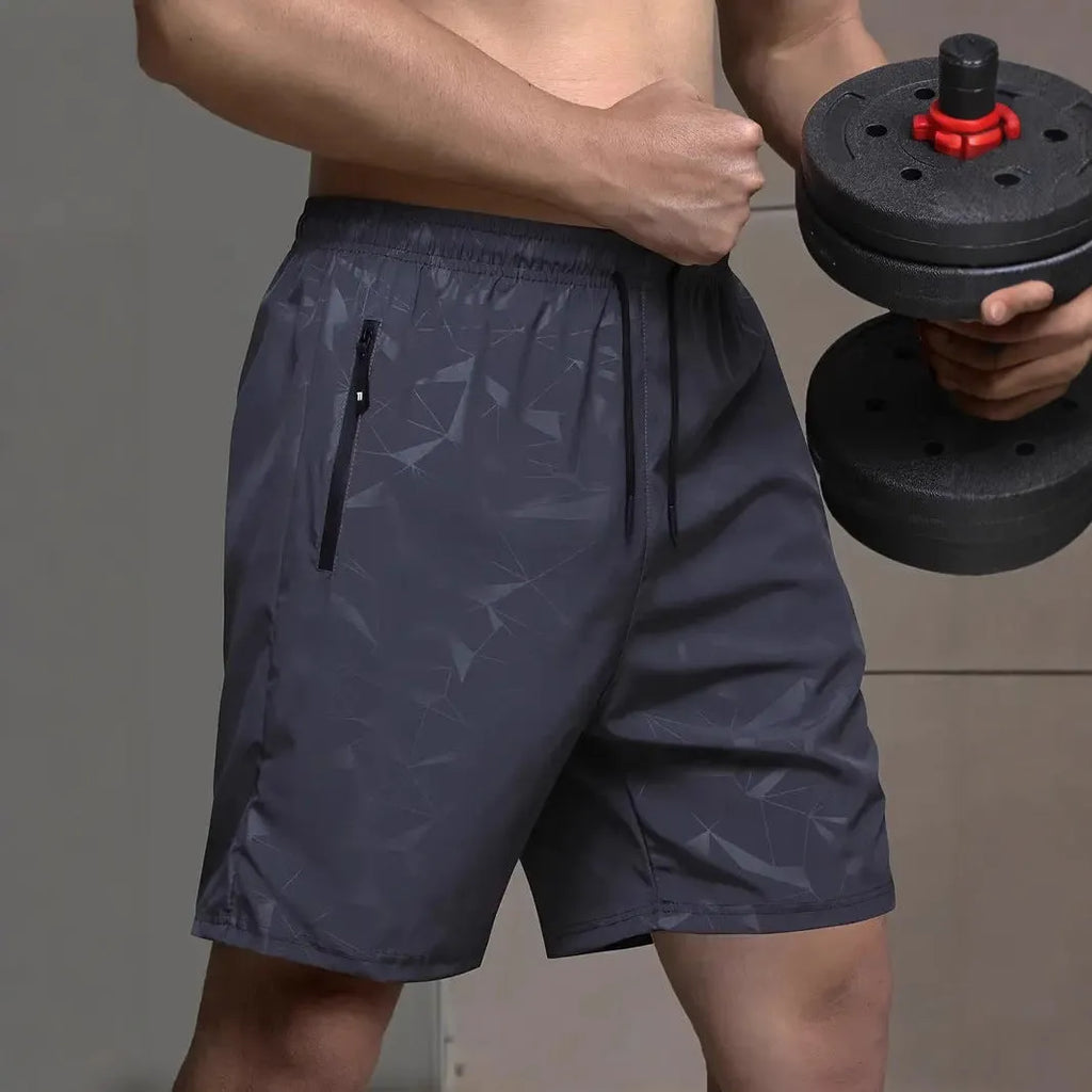 Men's loose fit sports shorts in polyester fibre available in black, gray and blue colours with elastic waistband