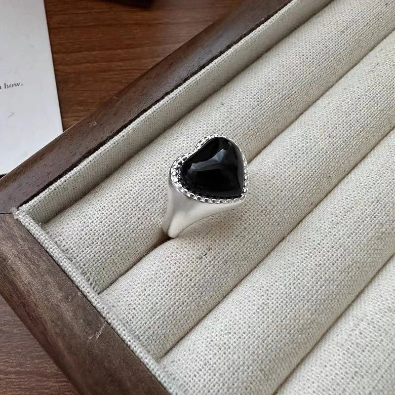Adjustable sterling silver ring with heart-shaped black agate in open-mouth design