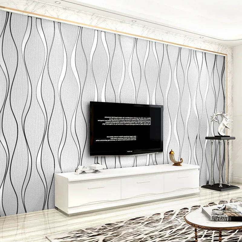 Close-up of light grey 3D curved stripe wallpaper with textured velvet finish.