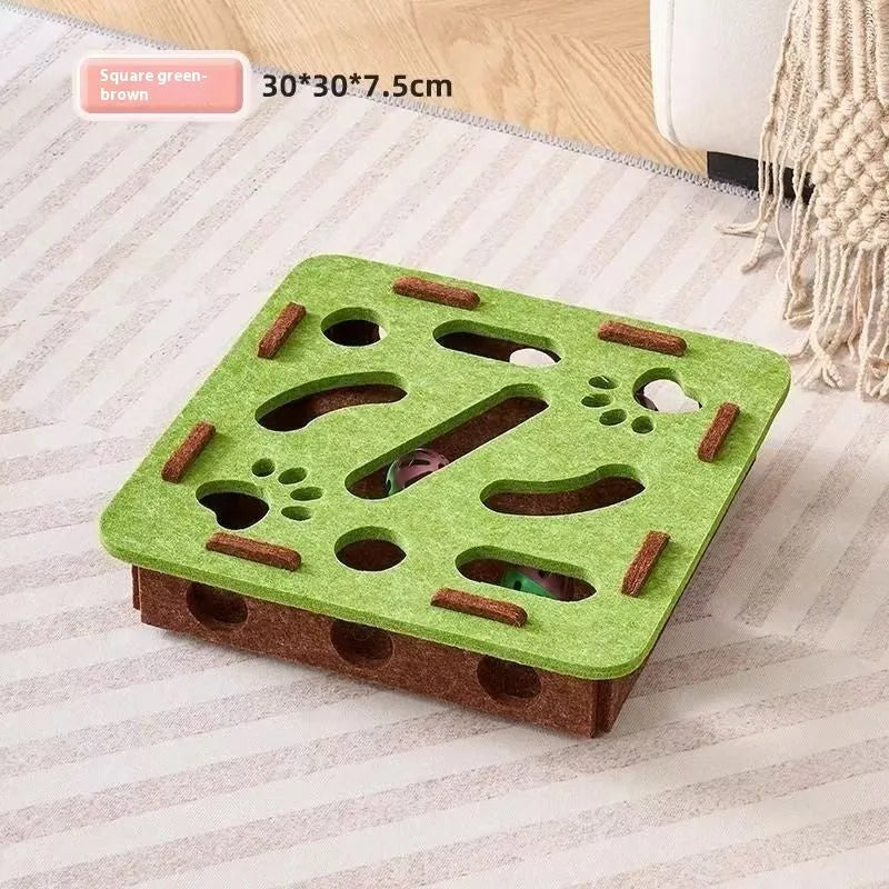 Green brown felt box cat toy with holes for interactive puzzle play.