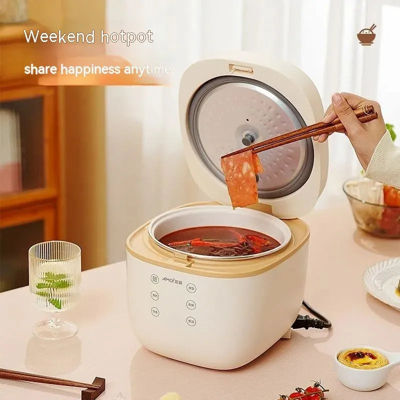 White or beige 3L rice cooker with black inner pot, rice scoop, measuring cup and steamer basket