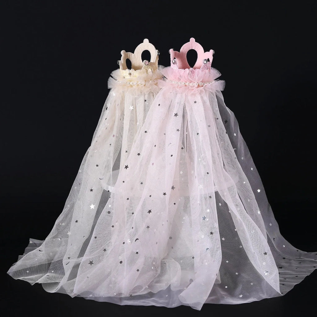 Cat wearing princess crown headdress with veil in beige or pink colour for wedding celebrations
