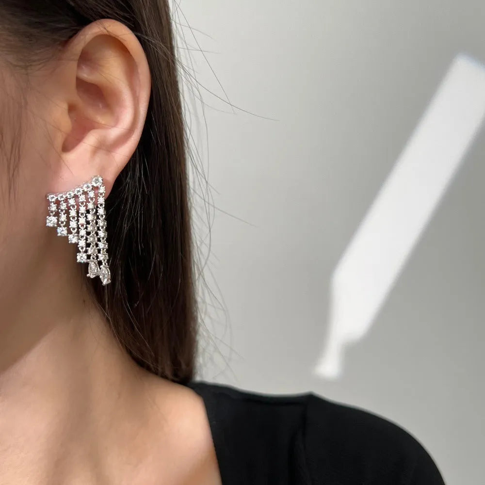 S925 sterling silver stud earrings with round zircon inlay geometric design on white background platinum finish