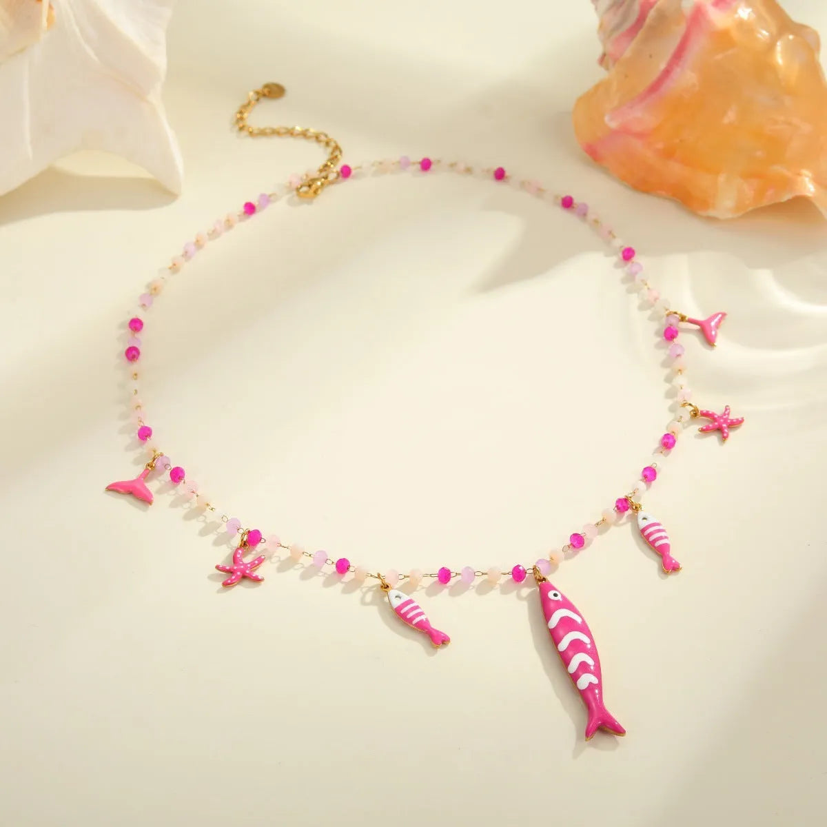Women's stainless steel coloured beaded necklace with fish pendant in pink, 18K electroplated, adjustable 41-50cm