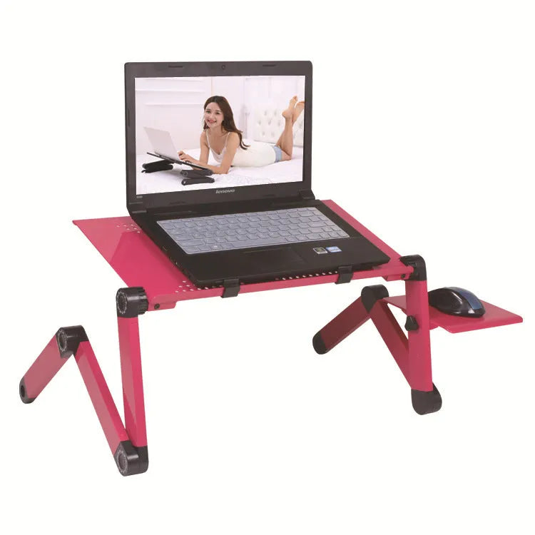 Black folding metal computer desk with cooling fan and laptop in use.