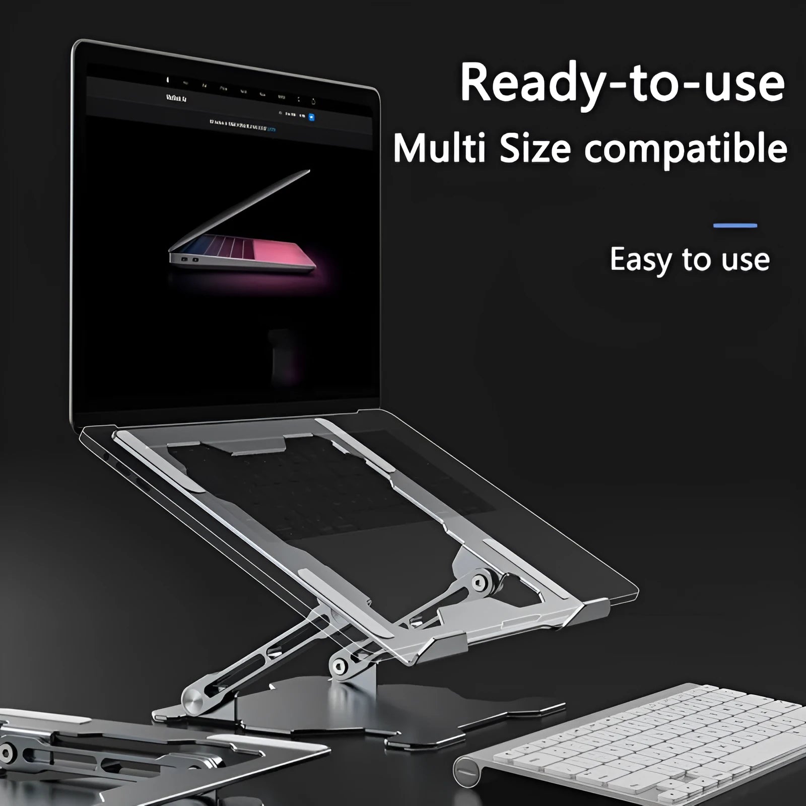 Grey aluminium laptop stand folded flat next to an open laptop, showing its adjustable angle and hollow design.