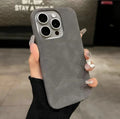 Solid colour suede-effect iPhone case in matte finish showing light grey, dark grey, red, blue, green and orange options.