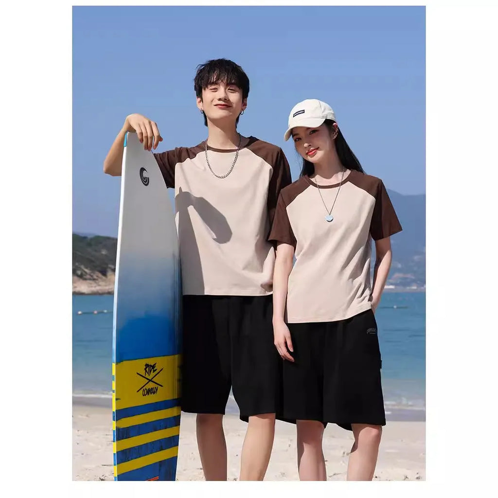 Round neck loose fit cotton blend t-shirt in army green colour on a hanger.