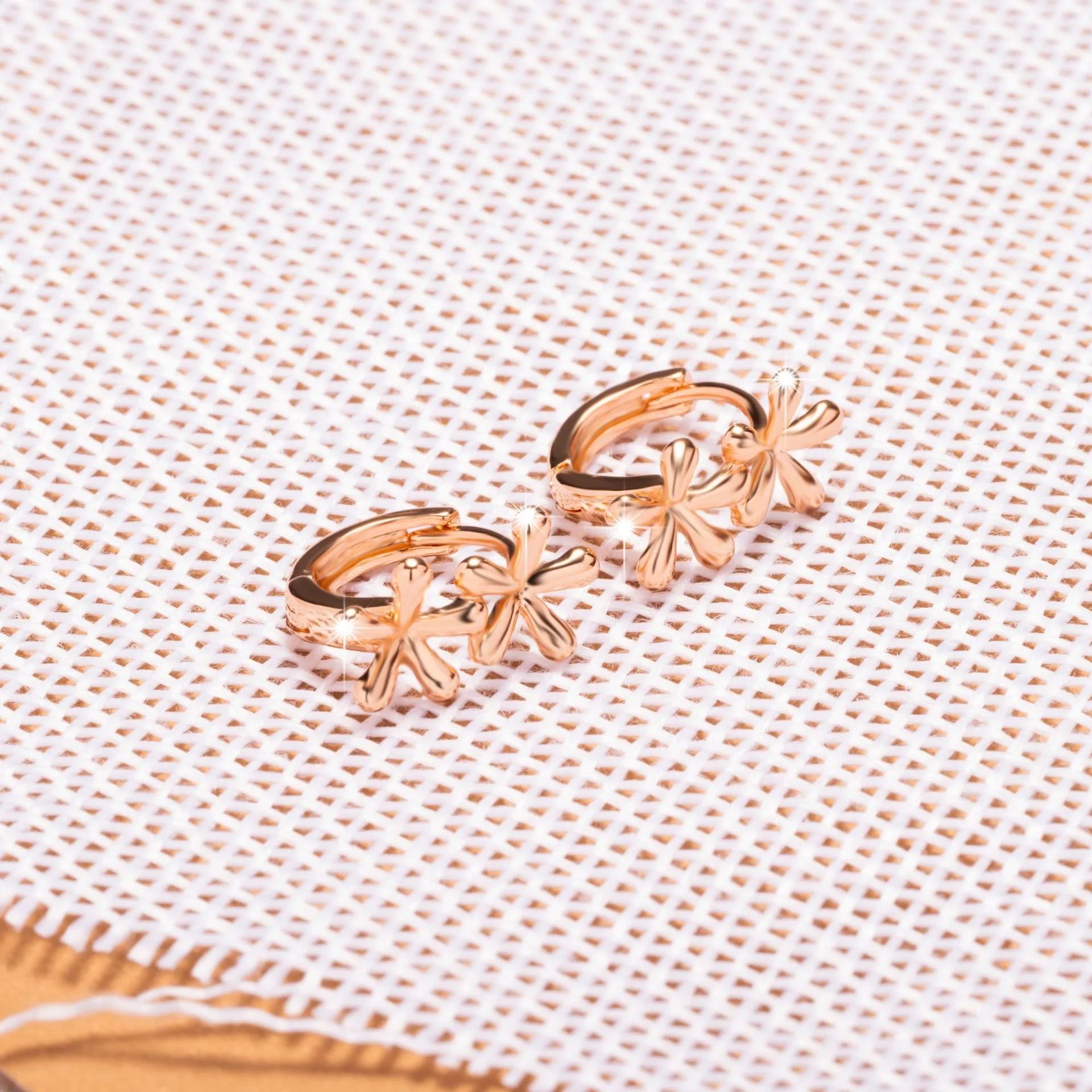 A pair of circular rose gold waterdrop flower earrings for women with a fresh, sweet style.