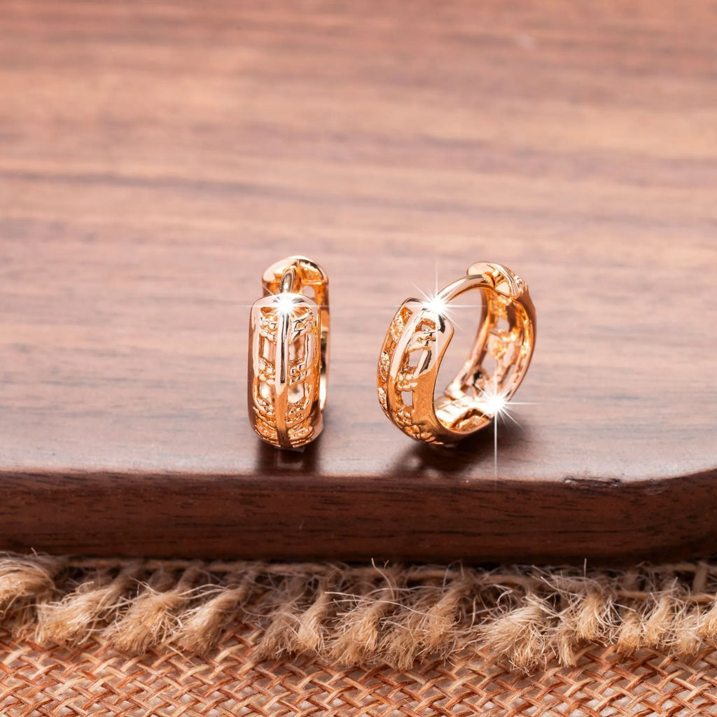 Rose gold hollowed-out copper earrings in heart and leaf shapes