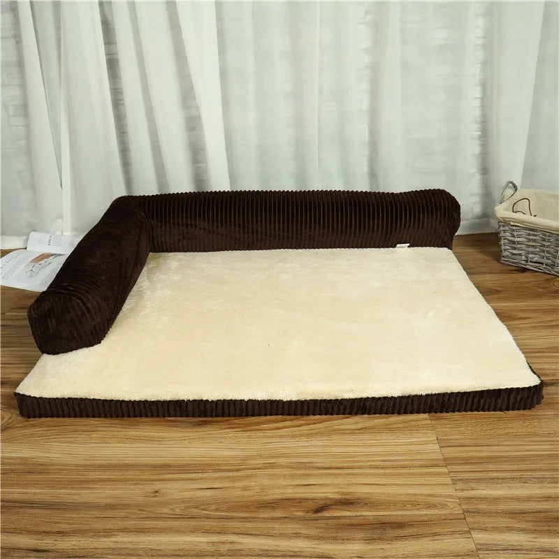 A corduroy dog sofa bed with raised sides in a grey colour, shown on a wooden floor.