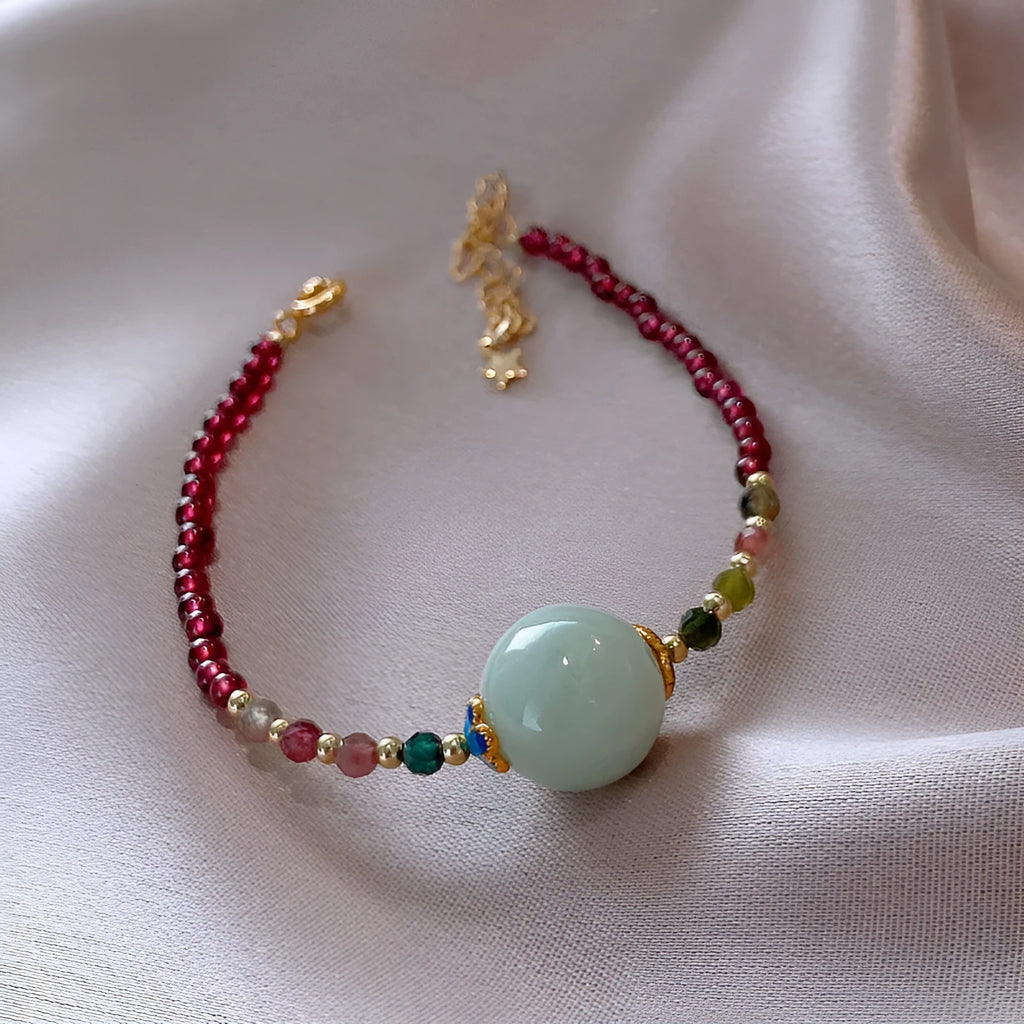 Women's Chinese style bracelet with garnet colour, drop-shaped tourmaline stones and electroplated finish