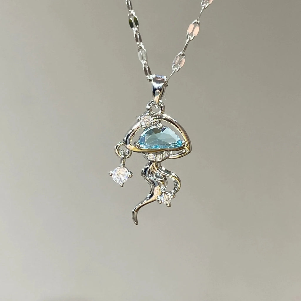 Blue jellyfish pendant necklace on adjustable sterling silver chain with white gold plating