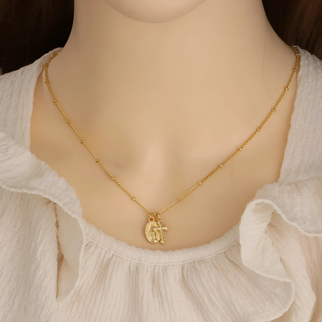 Gold geometric Virgin Mary cross necklace pendant on chain