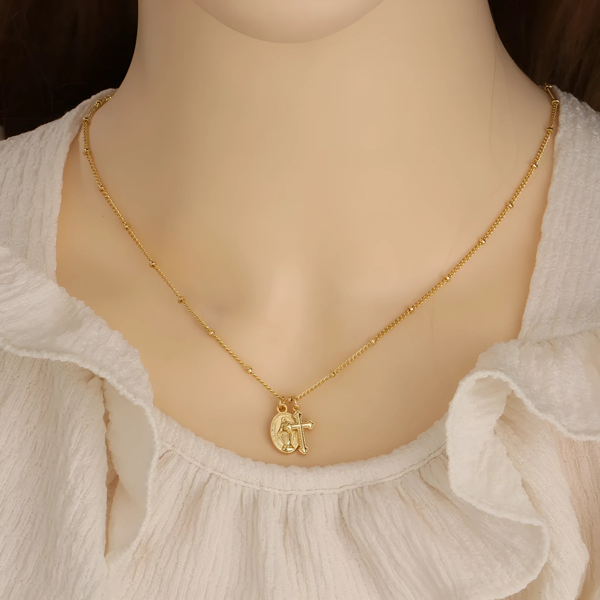Gold geometric Virgin Mary cross necklace pendant on chain