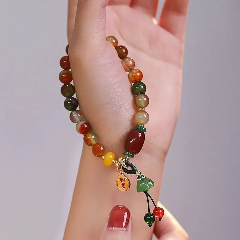 M990 Lotus Ruyi bracelet showing lotus decorative elements and mixed material construction