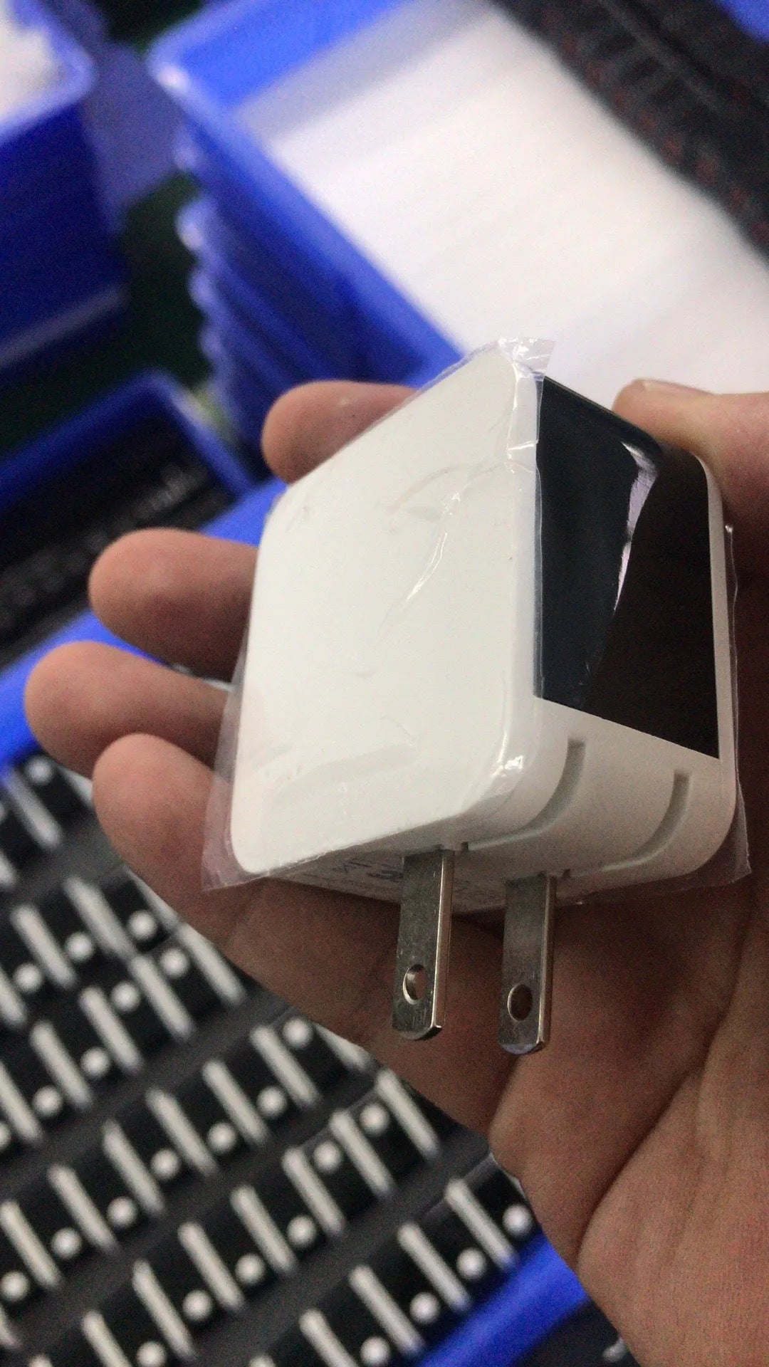 5V 2.4A dual USB travel charger with digital display in black, white, or red.