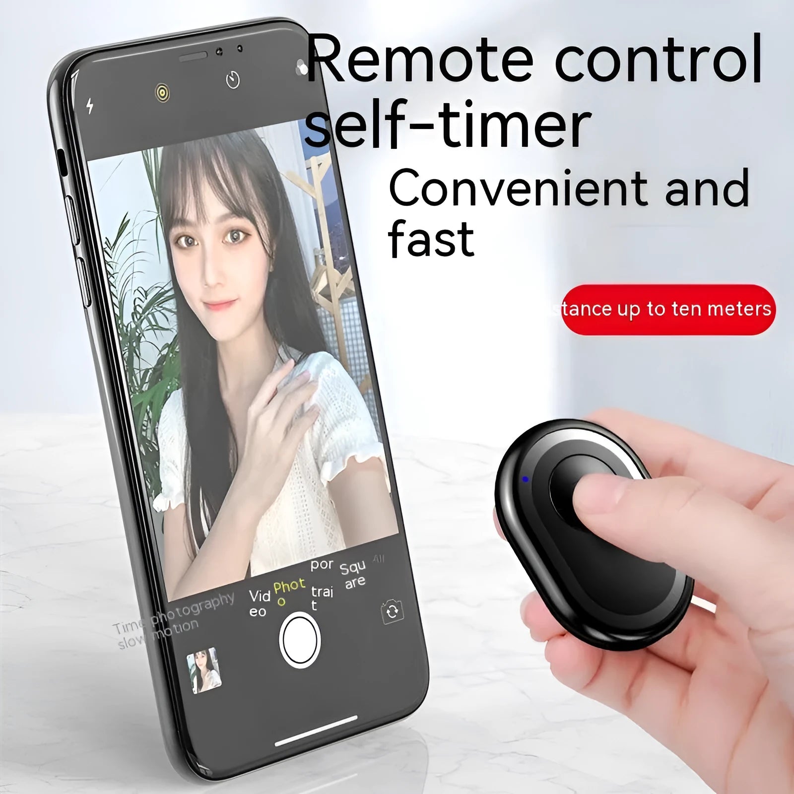 Small black wireless Bluetooth remote control for smartphone photography