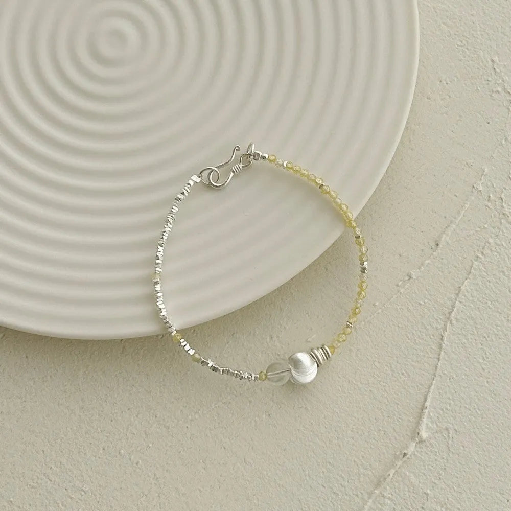 Women's 925 sterling silver brushed ball bead bracelet, round geometric design, electroplated silver finish, on neutral background