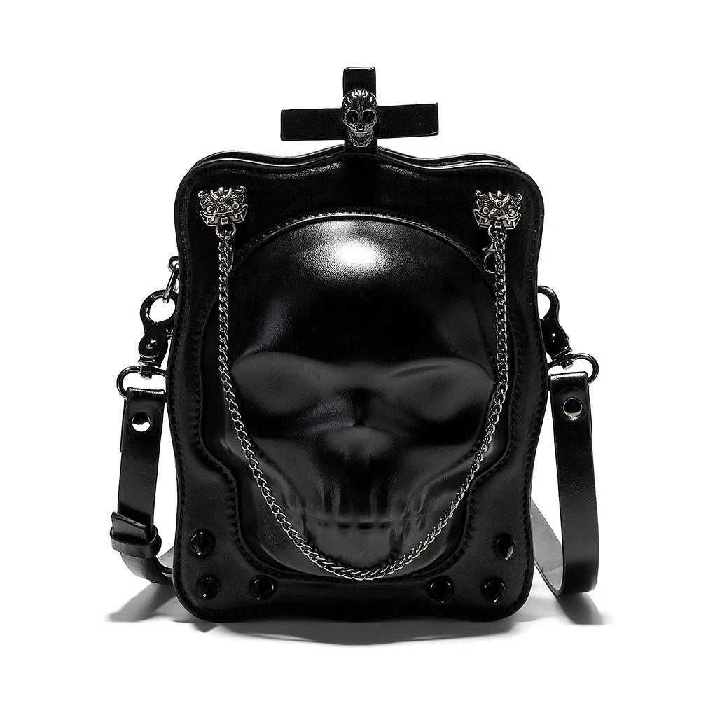 Black square mini crossbody bag with embroidered skull design, metal rivets, and a chain shoulder strap.