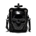 Black square mini crossbody bag with embroidered skull design, metal rivets, and a chain shoulder strap.