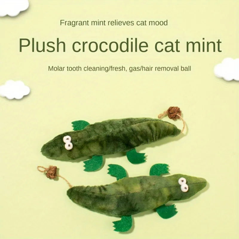 Green plush alligator cat toy with plant-based materials and peppermint scent for oral care