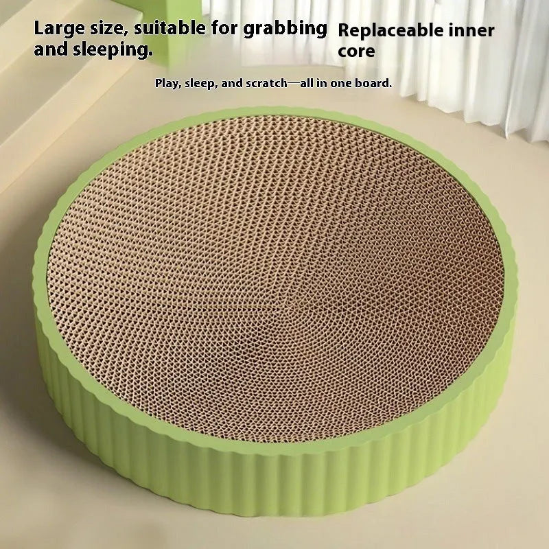 Round green and white corrugated paper cat scratching board and bed, 55cm diameter.