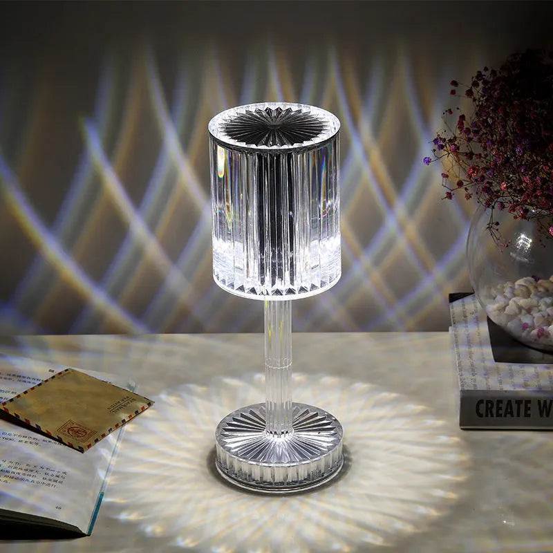 Modern crystal table lamp with touch dimming base and transparent K9 crystal bead lampshade on a nightstand.