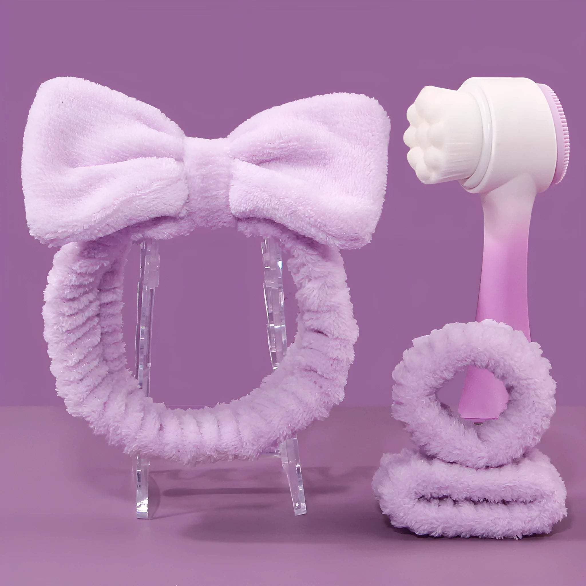 Facial brush three-piece set with coral fleece headband, four toothbrushes, and face wash suits in purple colour.