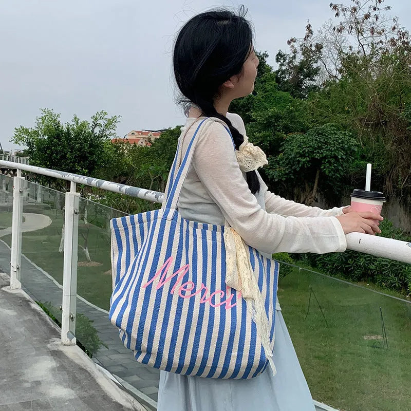 Blue striped letters printed on pink blue and white striped cotton canvas bag