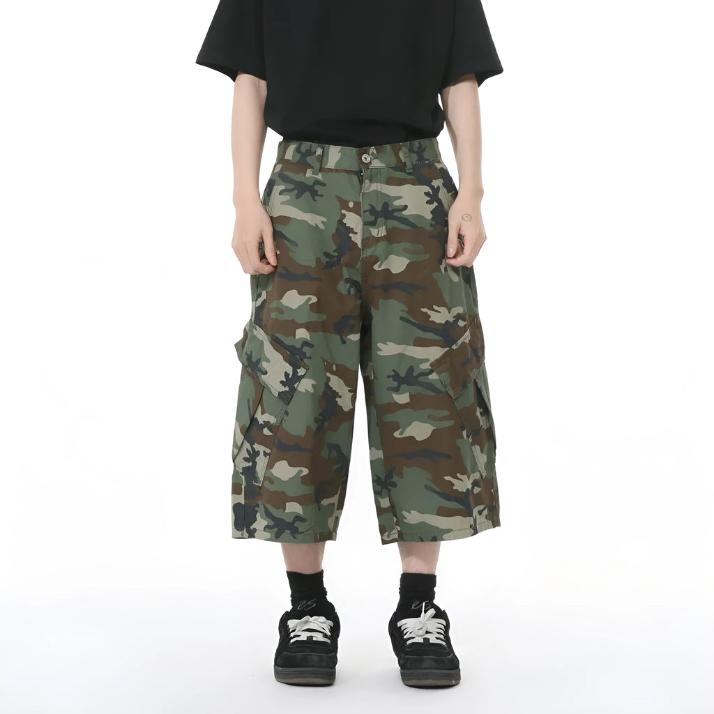 Men's camouflage pattern cotton trousers with wide leg design and cropped length showing side stitching detail